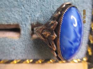 lot 278 image: silver toned ring with a smooth blu...