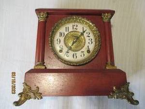 lot 283 image: Wood encased mantle clock with bras...