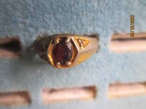 lot 287 image: Mens gold tone ring with a garnet ...