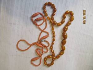 lot 303 image: Set of (2) Vintage amber toned bead...