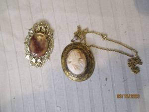lot 307 image: A genuine Cameo pendant sits on the...