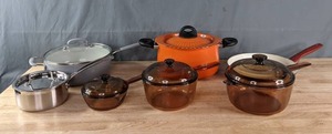An Assortment of Pots and Pans Including The Pioneer Woman Pan, Cuisinart Pot, Bialetti Pot and More   C