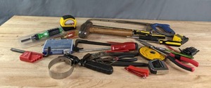 An Assortment of Tools Including a Saw, Hammer, Screwdrivers and More  K