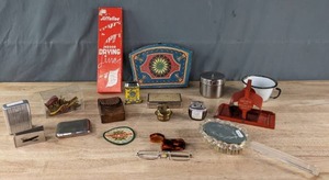 An Assortment of Vintage Cigarette Case, Lighter, 1940s Brush, Jiffeline Drying Line, and More K