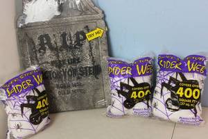 lot 157 image: NEW Light Up Gravestone Deocration and 1,200 Sq Feet Of Super Stretch Spiderweb Decorations