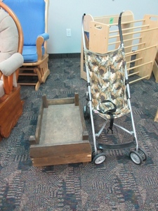 lot 110 image: COSCO CAMOUFLAGE STROLLER AND WOODEN CRIB