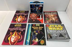 lot 31 image: Group Of Star Wars Books And Tin