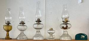 lot 56 image: Shelf Full Of Vintage Glass Oil lamps