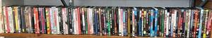 lot 59 image: Shelf Full Of Misc. DVDs Some NIB