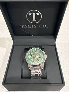 lot 15 image: Brand New Talis & Co. Green Skeleton Dial Watch $729 Retail