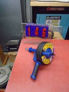 Hand drain auger. Has a drill attachment for power. As shown.