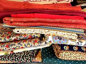 lot 213 image: Another Large Grouping of Vibrant Fabrics