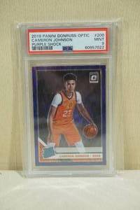 lot 15 image: 2019 Panini Donruss Optic Cameron Johnson #200 Rookie Purple Shock Basketball Card - PSA 9