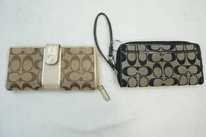 lot 302 image: Coach hand clutches