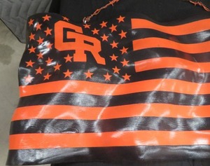 BENEFIT ITEM  ORANGE AND BLACK GR WRESTLING FLAG