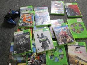 lot 136 image: xbox 360 games and a controller...