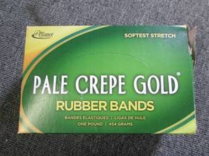 lot 160 image: box of pale crepe gold rubber bands...