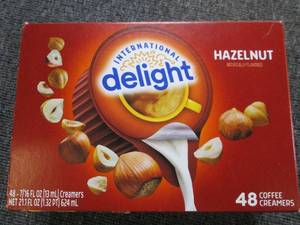 lot 269 image: package of hazelnut coffee creamers...