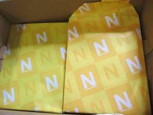 lot 402 image: package of 4 reams of orange 8.5x11...