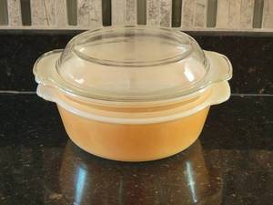 lot 44 image: Fire King Peach Luster Casserole Group