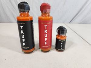 lot 234 image: 3 New Glass Bottles of Truffle Infused Hot Sauce