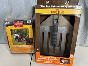 lot 108 image: New Giant Spatula and Lawn Mower Cover