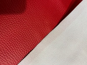 lot 173 image: Large Roll of Thick Red Textured Vinyl