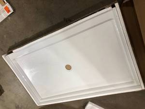 lot 53 image: CRAFT  MAIN  60 in. L x 36 in. W Alcove Shower Pan Base with Center Drain in White Customer returns Review all pictures