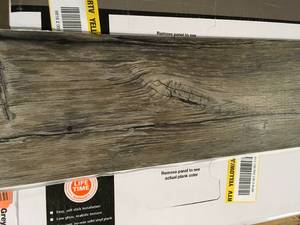 lot 31 image: TrafficMaster  Walnut Ember Grey 4 MIL x 6 in. W x 36 in. L Peel and Stick Water Resistant Luxury Vinyl Plank Flooring (36 sqftcase) Lot of 6 Customer returns Review all pictures
