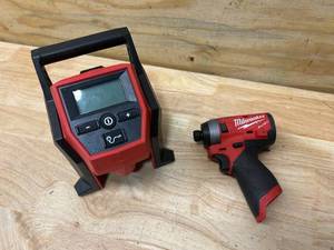 lot 100 image: MILWAUKEE M12 14 Impact Driver and Compact Inflator (Tools Only)