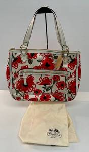 lot 15 image: Coach Brand Poppy Print Satin Bag With Dust Bag Preloved Condition (Light Stains Pen Marks On Inner Pocket)