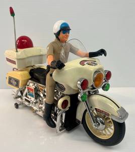 lot 31 image: 1984 Bump And Go Battery Operated Police Motorcycle (Works) (Some Plastic Yellowed)