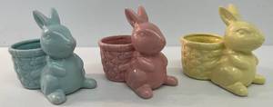 lot 89 image: Three Pastel Colored Bunny Planters