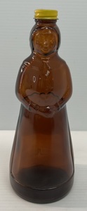 lot 207 image: 1980 Mrs. Butterworth Syrup Bottle