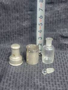 lot 205 image: Vintage Apothecary Chloroform Glass Bottle and Metal Case with Spring Lid, German
