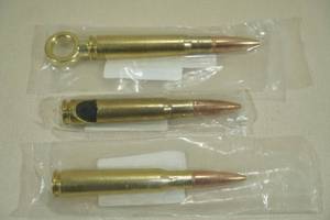 lot 52 image: Lucky Shot 50 Cal BMG Corkscrew, Bottle Opener, and Tap Handle