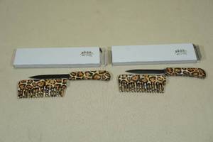 lot 124 image: 2 Leopard Print Hair Comb Knives