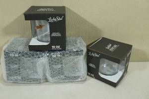 lot 154 image: Lucky Shot Rocks Glasses with Embedded Bullets