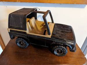 lot 160 image: Tonka Jeep - Black and light brown in color