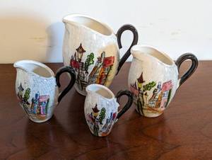 lot 229 image: Set Of Four Ceramic Pitchers