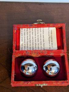 lot 261 image: Set Of Two Chinese Exercise Balls In Case