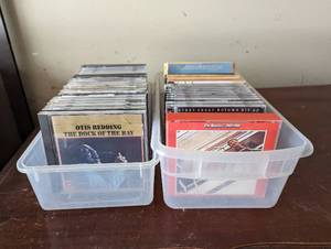 Two Small Bins of CDs and Travel DVDs
