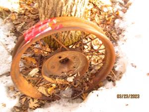 lot 26 image: Antique steel tire rim with spokes...