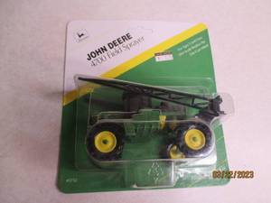 lot 101 image: Ertl Toys John Deere 4700 Field Spr...