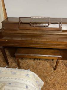 lot 500 image: Upright piano with a bench