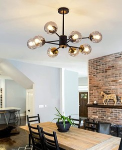 lot 90 image: 8-Light Glass Globe Matte Black & Gold Sputnik Ceiling Chandelier