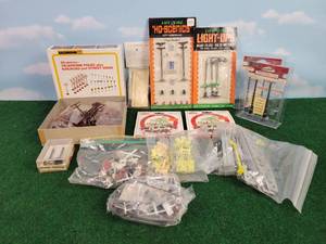 lot 645 image: Large Lot of New & Used HO Scale Signs, Power Poles, Animals and More