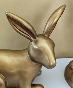 lot 47 image: Pair of Gold Colored Resin Bunnies