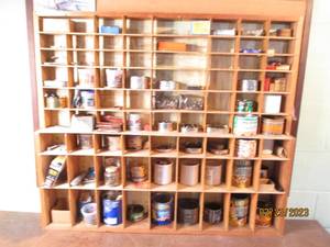 Wood wall shelf filled with assorte...