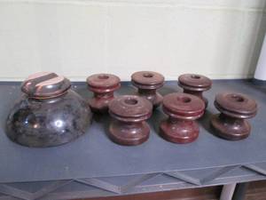 Electrical insulators, one has a sc...